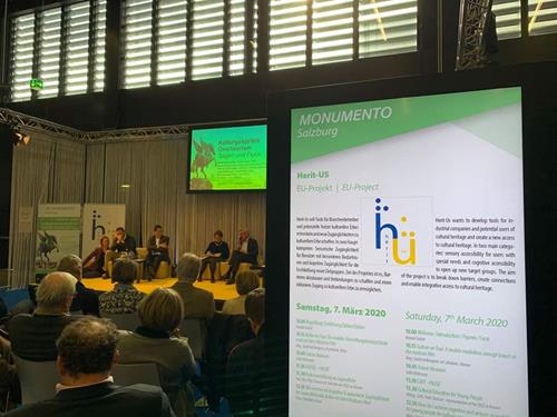 Fotografía del escenario con los ponentes durante una de las conferencias de Herit-us